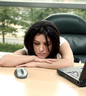 Girl Tired at her Desk During The Day
