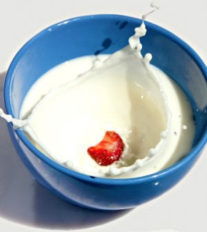 Strawberry Dropping into a Bowl of Milk