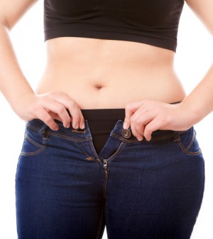 Woman Zipping Tight Jeans