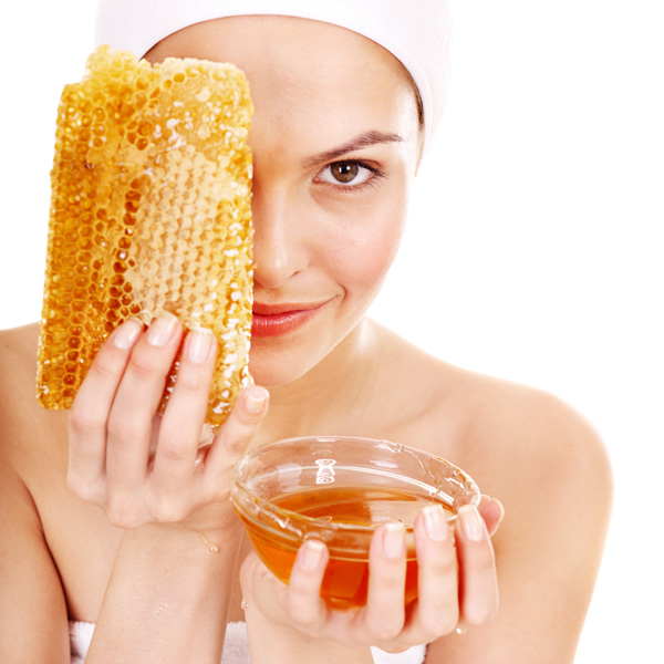 Woman Cleaning Her Face With Honey