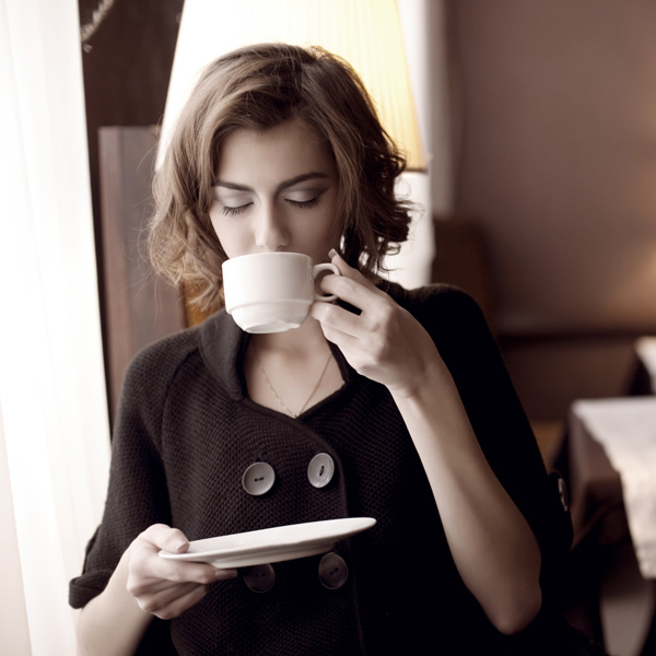 Woman Relaxing with a Cup of Valerian Tea